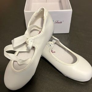 Dancing fair white tap shoes.